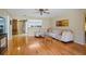 Comfortable living room featuring hardwood floors, a plush sectional sofa, and an open layout at 8763 Matthew St, Seminole, FL 33772