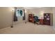 This office features neutral walls, carpet, a window, and a wood desk with shelving at 8763 Matthew St, Seminole, FL 33772
