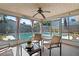 This sunroom has seating, a ceiling fan, and a view of the pool at 8763 Matthew St, Seminole, FL 33772