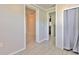 Hallway with fresh paint and new floors connects the rooms in this updated home at 905 W Ball St, Plant City, FL 33563