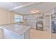 Stylish kitchen featuring sleek appliances and breakfast bar island, plus ample cabinet storage at 905 W Ball St, Plant City, FL 33563