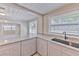 Updated kitchen with granite counters and modern finishes, view into other room at 905 W Ball St, Plant City, FL 33563