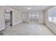 Open concept living space with grey walls, light floors and ample natural light at 905 W Ball St, Plant City, FL 33563
