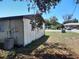 Exterior of the home from the backyard, showing AC Unit at 9355 Pinero St, Spring Hill, FL 34608