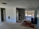 View of the living room showing doorway to the kitchen at 9355 Pinero St, Spring Hill, FL 34608