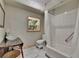 Bright bathroom with a stand alone sink and tub at 9724 Hermit Hollow Ln, Gibsonton, FL 33534