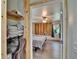 A peek into the light bedroom with wood accents from the closet at 9724 Hermit Hollow Ln, Gibsonton, FL 33534