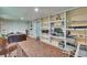 Cozy bedroom features built-in shelving, mosaic tile floors, and ample storage space at 9724 Hermit Hollow Ln, Gibsonton, FL 33534