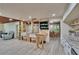 Spacious kitchen with a farmhouse sink, butcher block island, and open shelving, blending rustic charm with modern amenities at 9724 Hermit Hollow Ln, Gibsonton, FL 33534