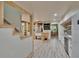 Bright open kitchen with wood-style flooring, modern appliances, and natural light, creating a welcoming culinary space at 9724 Hermit Hollow Ln, Gibsonton, FL 33534
