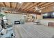 Open living room featuring wood floors, a ceiling fan, and natural light at 9724 Hermit Hollow Ln, Gibsonton, FL 33534