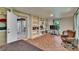 Cozy living room boasts custom built-in shelving and lots of natural light at 9724 Hermit Hollow Ln, Gibsonton, FL 33534