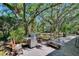 Outdoor patio area with a stainless steel grill and seating at 9724 Hermit Hollow Ln, Gibsonton, FL 33534