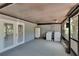 Appliance area on a covered porch with washer, dryer and refrigerator at 9724 Hermit Hollow Ln, Gibsonton, FL 33534
