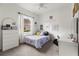 Bedroom featuring decor, a ceiling fan, and a window with natural light at 10142 Deercliff Dr, Tampa, FL 33647