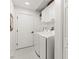 Laundry room with a washer and dryer and storage cabinets at 10142 Deercliff Dr, Tampa, FL 33647