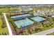 Aerial view of community tennis courts, part of a neighborhood's recreational amenities, offering a space for sports at 10142 Deercliff Dr, Tampa, FL 33647
