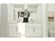 Double vanity bathroom, with decorative plant, a large mirror, and a separate toilet area at 10258 Gentle Rain Dr, Land O Lakes, FL 34638