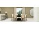 Elegant dining room featuring a modern table with stylish chairs, bathed in natural light, perfect for Gathering meals at 10258 Gentle Rain Dr, Land O Lakes, FL 34638