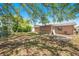 Spacious back yard with mature trees and partial fencing at 1051 Normandy Blvd, Holiday, FL 34691
