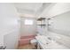 Simple bathroom with a bathtub, toilet, and vanity mirror at 1051 Normandy Blvd, Holiday, FL 34691