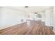 Spacious living area with sliding glass doors, ceiling fan, and wood-look flooring at 1051 Normandy Blvd, Holiday, FL 34691
