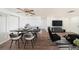 Open-concept living and dining areas with ceiling fan and modern furniture at 1051 Normandy Blvd, Holiday, FL 34691