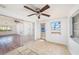 Bright sunroom features tile floors, a ceiling fan, and sliding glass doors at 1051 Normandy Blvd, Holiday, FL 34691