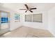 Bright sunroom with tile floors, a back door and large screened windows at 1051 Normandy Blvd, Holiday, FL 34691