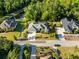 Beautiful home with lush landscaping and a sparkling pool, captured in a stunning aerial shot at 10726 Miracle Ln, New Port Richey, FL 34654
