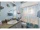 Stylish bathroom decorated with marine life accents and a nautical theme at 10726 Miracle Ln, New Port Richey, FL 34654