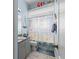 Charming bathroom featuring nautical decor and a playful shower curtain at 10726 Miracle Ln, New Port Richey, FL 34654
