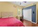 This bedroom boasts hardwood floors, neutral walls, and a spacious closet at 10726 Miracle Ln, New Port Richey, FL 34654