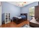 Comfortable bedroom with a ceiling fan, ample closet space, and natural light at 10726 Miracle Ln, New Port Richey, FL 34654