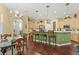 A spacious kitchen is shown with a central island, stainless steel appliances, and wooden cabinets at 10726 Miracle Ln, New Port Richey, FL 34654
