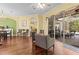 Open-concept living area featuring hardwood floors, neutral walls, and sliding doors offering a view of the outdoor space at 10726 Miracle Ln, New Port Richey, FL 34654