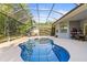 Sparkling screened-in pool and patio, perfect for outdoor enjoyment and relaxation at 10726 Miracle Ln, New Port Richey, FL 34654