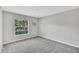 Empty carpeted bedroom with a window at 10936 Rainbow Pyrite Dr, Wimauma, FL 33598