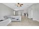 Spacious living room featuring neutral walls, tile floors, and an open design with lots of natural light at 10936 Rainbow Pyrite Dr, Wimauma, FL 33598