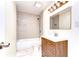Cozy bathroom with a shower-tub combo and charming vanity at 1120 Country Ln, Lutz, FL 33558