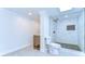 Modern bathroom with white marble tile shower and updated fixtures at 1120 Country Ln, Lutz, FL 33558