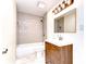 Cozy bathroom with a shower-tub combo and charming vanity at 1120 Country Ln, Lutz, FL 33558