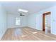 Bedroom featuring wood floors, wainscoting, and a skylight at 1120 Country Ln, Lutz, FL 33558