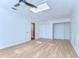 Bright bedroom with ceiling fan, skylight, and closet at 1120 Country Ln, Lutz, FL 33558