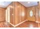 Entryway with wood-paneled walls and decorative glass door at 1120 Country Ln, Lutz, FL 33558