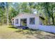 Charming guesthouse featuring sliding glass doors and an inviting backyard at 1120 Country Ln, Lutz, FL 33558