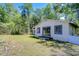 Charming guesthouse featuring sliding glass doors and an inviting backyard at 1120 Country Ln, Lutz, FL 33558