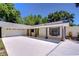 Home featuring a driveway with covered walkway leading to the garage at 1120 Country Ln, Lutz, FL 33558