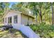Charming guesthouse featuring sliding glass doors and an inviting backyard at 1120 Country Ln, Lutz, FL 33558