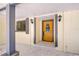 Inviting front door with decorative glass and stone tile porch at 1120 Country Ln, Lutz, FL 33558
